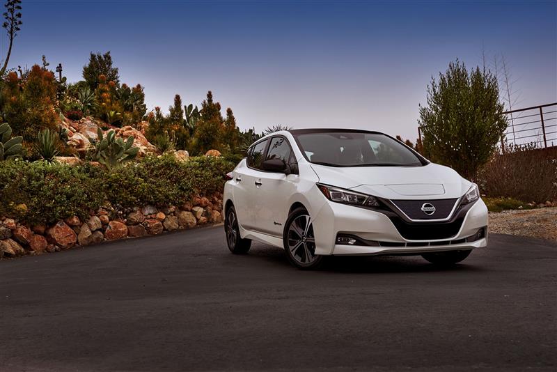 elegant driveway view of white 2018 Nissan Leaf